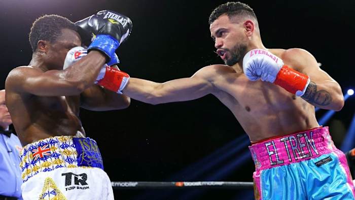 Robeisy 'El Tren' Ramirez (R) beats Isaac Dogboe (L) to win the featherweight world championship early this year. The Cuban, Ramirez will defend his title against the unbeaten Mexican contender Espinoza on December 9th in Florida. MIKEY WILLIAMS TOP RANK.